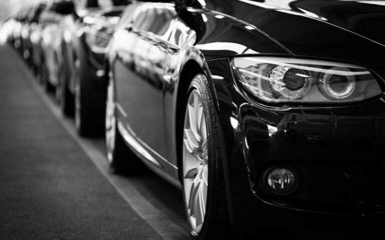 A side view of multiple cars in a line.